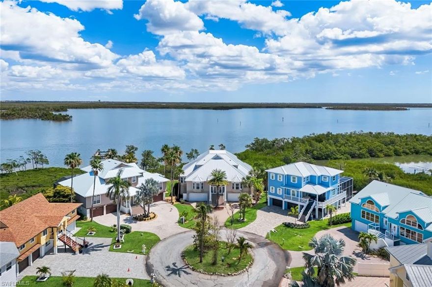 Rare Bayfront Duplex Opportunity on Fort Myers Beach
Stunning bayfront duplex offering the best of both worlds—direct boating access and a short walk to the beach. Located at the end of a quiet cul-de-sac, this property features approximately 6,101 sq ft under air (unit B 3,006 sq ft unit A 3,095 sq ft) and is built on concrete pilings, effectively creating a 3-level structure.

Professionally remodeled following hurricane damage, including installation of new code-compliant hurricane shutters. Multiple balconies and large windows provide expansive bay views from upper levels.
Each unit offers:
Top floor primary suite with balcony, dual walk-in closets, and spacious bathroom
Second level with 2 bedrooms and Jack & Jill bathroom
Main living area with open kitchen, dining, and 2-story great room with balcony
Ground level garage space with capacity for multiple vehicles

The property offers flexible use options: live in one side and rent the other, short- or long-term rental investment, or combine both units through existing interior access points on each level.

Previously operated as a vacation rental property and will be reintroduced into a rental program. Property is offered turnkey furnished, excluding personal items and select artwork.

Recent updates include:
New metal roof 
Updated A/C systems
Vinyl flooring
Impact sliding doors (primary suites)
Pool resurfacing with new tile and spa
New pool equipment

Additional features:
Elevator shaft (currently non-operational)
Mangrove trimming permit in place (recently completed)
3 separate parcel IDs (per county records)

Important notes:
Dock was damaged by Hurricane Ian and will require replacement (information available)
Property is sold as-is

Showings by appointment only.