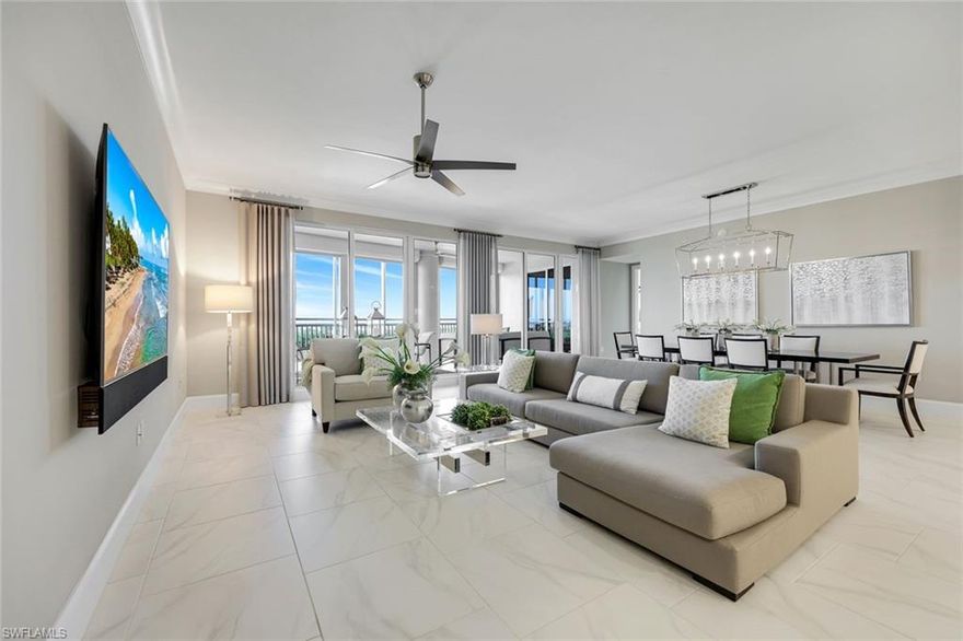 Enjoy easy, elevated high-rise living in this GORGEOUS THREE BEDROOM PLUS den residence in Seaglass at Bonita Bay—a sophisticated home perfectly positioned within the building for an ideal blend of privacy, views, and convenience. From the moment you enter, you’ll be drawn to the volume ceilings, expansive windows, and the effortless indoor-outdoor flow that creates the perfect setting for entertaining or relaxing in style. The home’s state-of-the-art kitchen is designed to impress, featuring refined finishes, abundant storage, and a seamless connection to the main living areas. Open to the living and dining spaces, the great room extends naturally to the lanai, allowing the outdoors to become a true extension of the home. Enjoy the luxury of multiple outdoor living spaces, perfect for taking in morning sunrises and glowing evening skies—and even better, every bedroom offers outdoor access, enhancing the lifestyle and livability of this exceptional residence. The thoughtfully designed split-bedroom floor plan provides privacy for the primary suite and guests alike. A dedicated den/office adds the perfect versatile space for remote work, reading, or a media room. Every detail has been considered, including custom-designed closets throughout, enhancing organization and maximizing storage in every room, along with remote-control hurricane shutters, a new hot water tank (2023), a WaterCop leak detection system throughout the home, a reverse osmosis drinking water system, remote blackout shades in all bedrooms, custom closets completed in 2025, and an air scrubber system. Additional conveniences include private elevator access and an easily accessible rooftop terrace, offering yet another opportunity to enjoy the beautiful Southwest Florida skies and coastal breezes. Residents of Seaglass at Bonita Bay enjoy a recently upgraded, exceptional amenity center featuring a state-of-the-art fitness facility, theater, social rooms, steam rooms, and a stunning resort-style pool—plus full access to the unmatched lifestyle and natural beauty of Bonita Bay. Bonita Bay offers an array of exceptional amenities, including a private beach club, kayaking, canoeing, pickleball, tennis, and multiple community parks. Explore over 12 miles of walking and biking paths, or take advantage of the full-service marina and restaurant. Golf enthusiasts will appreciate the FIVE on-site courses, complemented by several dining options, a state-of-the-art fitness center, tennis, and more—all available with club membership (additional fees apply). Ideally located close to ALL that Southwest Florida has to offer—world-class dining and shopping, pristine beaches, nature preserves, the burgeoning downtown Bonita Springs, and downtown Naples—plus RSW International Airport just a short drive away. Whether you’re searching for a winter retreat or a permanent residence, this home could very well be THE ONE. Don’t miss this exceptional opportunity.