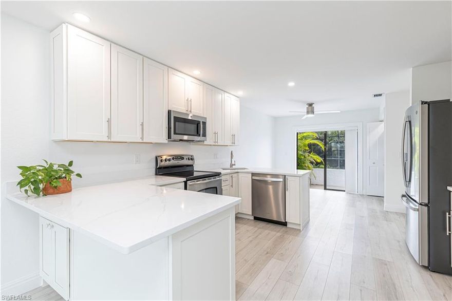 You can have it all with this luxe 2/1 apartment unit nestled in the highly sought after Southwest Cape Coral area and surrounded by million-dollar waterfront properties. This unit has been fully renovated from top to bottom and boasts a brand new high end kitchen with stainless steel appliances, modern quartz countertops and an upgraded HEATED pool overlooking a lake where nature and tranquility awaits you. New luxury vinyl flooring has been installed throughout the entire unit, as well hurricane impact windows with shutters. The master suite overlooks the lanai and is situated on lush, manicured grounds. This exceptional unit is in extremely close proximity to Cape Harbour, the Yacht Club, Downtown Cape Coral, Tarpon Pointe and shops/restaurants nearby; situated on a very private corner at the end of the block. Walking/bike paths line the block and neighborhood for wonderful leisurely walks and exercise options. This is truly paradise! Schedule your showing today and start living!