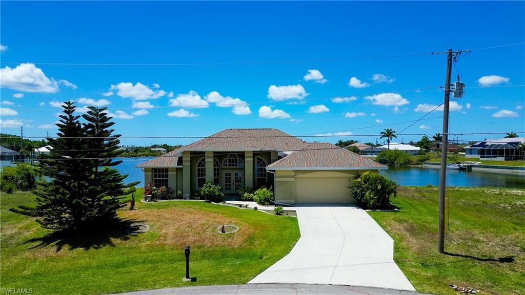 Photo of 2319 NE 19th ST, CAPE CORAL, FL 33909 (MLS # 2025018186)