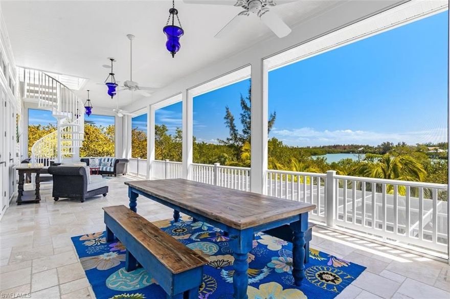 Nestled amongst lush tropical gardens, enjoy warm Gulf breezes and breathtaking views of Dinkins Bayou. This stunning island retreat boasts 3,883 sq ft with 4 Bedrooms + Den and 4.5 Bathrooms. Perfect for entertaining, two expansive screened lanais overlooking a large pool & spa offer hosts an abundance of entertainment space. Enjoy captivating sunsets from the rooftop deck with views of the Bayou & Gulf. For outdoor enthusiasts, enjoy quick Gulf access w/ a 16,000 lb. boat lift & dock. Great Room & Kitchen feature beamed ceilings with French doors opening to the lanais. Chef’s kitchen features custom Vetrazzo countertops, Wolf double range, Sub-Zero fridge/freezer, Miele dishwasher & lighted glass cabinets. The primary suite opens onto the travertine lanai overlooking a 6,000-gallon water garden. Guest bedrooms & office feature ensuite bathrooms & outdoor sitting areas w/ French doors for picturesque views. Large garages include space for 4 vehicles, elevator, bountiful storage & workshop. Equipped w/ impact resistant doors & windows, propane generator, fenced dog run, new landscaping, alarm system, lightning protection system, outdoor pest misting system. Furnished w/ exclusions.