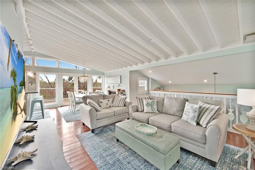 Ultimate Island privacy is yours at this stunning updated coastal inspired beach home which is adjacent by conservation land and so close to the beach. This exceptionally maintained home features gorgeous Brazilian cherry hardwood floors, updated kitchen with granite countertops and stainless steel appliances. The vaulted beam ceilings highlights an abundance of natural light and provide an open and airy feeling perfect for family gatherings. The primary suite is one of a kind with a separate sitting area and luxurious bathroom. Sitting room also can function as a second bedroom. Morning sunrises off the kitchen on your oversized Ipe wood exterior deck leads out to your custom pool featuring a tanning ledge with spa.