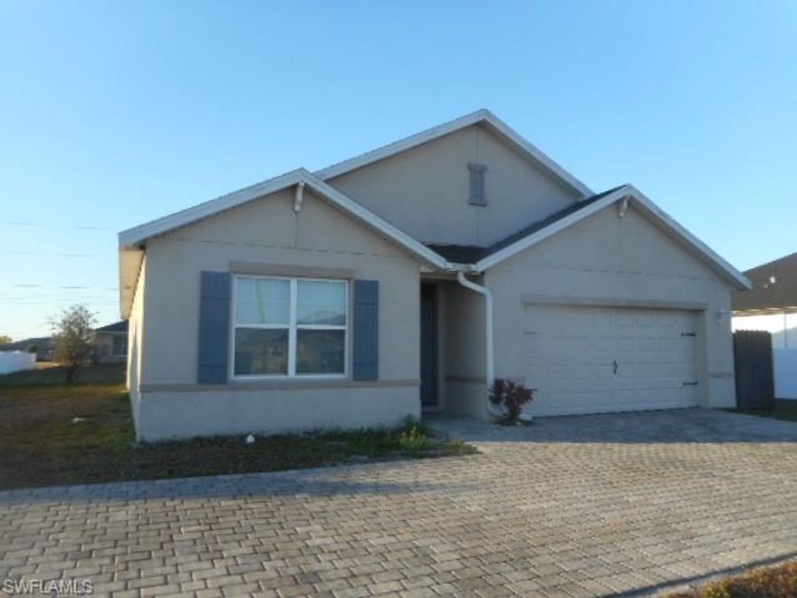 This is our CALI floor plan at 1828 square feet. Great NW Cape Coral location right near Nelson Rd and Tropicana Pkwy. Home comes with 36” Ashburn Sienna kitchen cabinets with hardware, quartz kitchen counters, solid surface bathroom counters, 18” tile everywhere except the bedrooms, carpet in bedrooms, stainless kitchen appliances, blinds on all windows except for slider, ceramic shower tile in both bathrooms, paver driveways and lanai, covered lanai, full irrigation system, electric garage door with opener