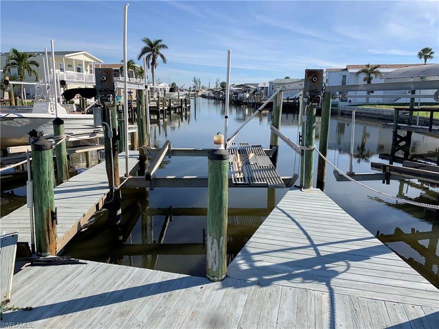 Beautiful vistas down this a canal front property with direct access to the Gulf of Mexico! Build your new dream home in paradise, close to all that SW Florida has to offer! Lot includes dock and boat lift. Bayside Estates, a highly desirable boating community, close to beaches, restaurants and more! 3 miles to Margaritaville Beach Resort, 8-miles to Sanibel Island. Take the trolley down to the beach, restaurants, and other local attractions. Bayside Estates is a 55+, manufactured home community with so many activities. Approximate Lot size 69'Fx89'Rx80'Lx34'B via Lee County Appraiser. Bayside Estates is a 55+, manufactured home community. Buyers in Bayside pay a $2600 resale capital contribution fee