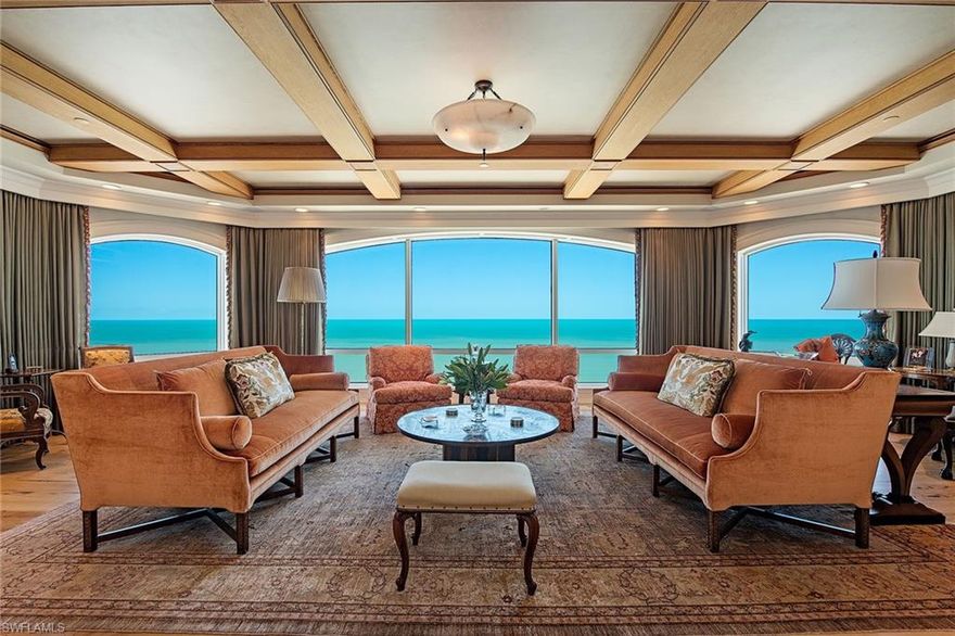 Step off your private elevator into this stunningly remastered beachfront penthouse with endless views of the Gulf located in the prestigious Windsor at Bay Colony. Encompassing over 8,550 square feet designed to meet the discerning taste of quality living and elegance while spanning the entire 19th floor. Features include the finest of warm chestnut flooring, custom cabinetry and millwork, an elegant wine room, spacious grand salon and custom bar area, office and library, media theater, magnificent chef's kitchen with state-of-the-art appliances including Wolf gas cooktop and Sub-Zero refrigeration, spacious two-room butler's pantry, smart home fully integrated Savant system and motorized Mecho shades. The primary suite is a masterpiece of luxury with dual baths, steam shower, custom closets, fitness room and office. Car enthusiasts will appreciate the three-car air-conditioned garage and an ideally positioned cabana leading to the pool terrace. The Windsor offers unmatched amenities with a redesigned 24-hour front desk, boardroom, social room, fitness, massage room, three guest suites, pool and spa. Bay Colony residents enjoy membership at the beach club and tennis center.