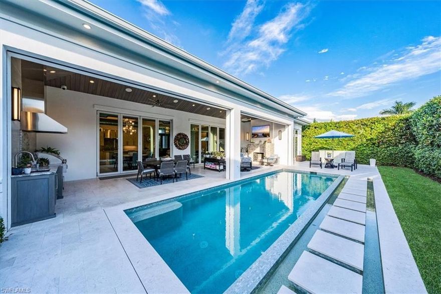 Embrace unparalleled opulence in this Park Shore masterpiece. Crafted in 2020 by Borelli Construction, this southern-facing jewel boasts an exquisite open floor plan, marrying indoor sophistication with outdoor grandeur. Designed by Jett & Company, each space exudes luxury with quartzite and marble countertops, wide plank white oak floors, and a chef's dream kitchen with elite SubZero/Wolf appliances. The master suite is a sanctuary of splendor, with dual walk-in closets and a sumptuous marble bathroom. Step onto the grand lanai, a haven for entertainment, featuring an outdoor kitchen, dining area, and a majestic pool and spa nestled in lush, tropical landscaping.Equipped with an advanced security system, home automation system and a robust Kohler generator, this residence is not just a home; it's a statement of extravagant living. Experience the pinnacle of luxury in this exquisite Park Shore abode. This home also has access to the exclusive private beach access for Park Shore