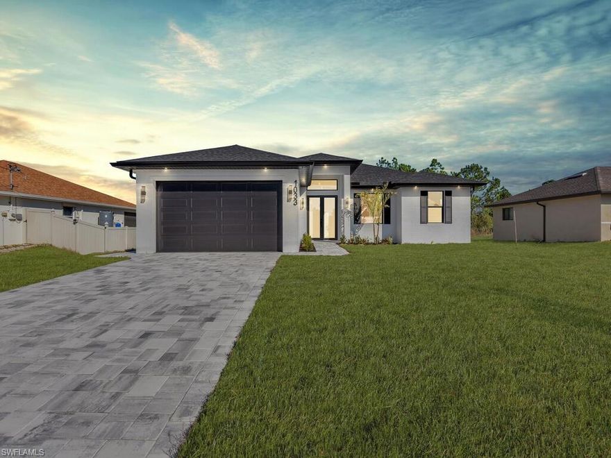 Step into modern luxury with this stunning new construction in the heart of Lehigh Acres, where every detail has been designed for comfort and style. The open and airy floor plan features a spacious master suite with a serene en-suite bath and ample closet space, accompanied by two additional bedrooms and a thoughtfully appointed second bathroom, perfect for family living. The heart of the home is the chef-inspired kitchen, seamlessly flowing into the dining and living areas, making daily life both functional and elegant. Step outside to discover a beautifully designed lanai and a fully equipped outdoor kitchen, ideal for savoring Florida’s sunshine while entertaining or enjoying quiet evenings. High-quality finishes, contemporary fixtures, and energy-efficient features throughout elevate the living experience, creating a home that balances sophistication with ease. This residence offers the perfect combination of indoor comfort and outdoor enjoyment, giving you the opportunity to embrace a lifestyle where convenience, style, and relaxation come together effortlessly. With its modern design, outdoor living amenities, and prime location in a thriving community, this home is a rare find for buyers looking to invest in their dream home today.