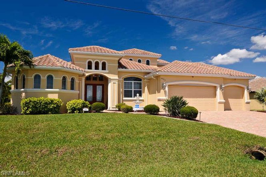 Absolutely gorgeous waterfront pool home with a million dollar water view. This finely crafted home shows better than a model! SAILBOAT ACCESS, NO BRIDGES OR LOCKS. Backyard paradise complete with outdoor kitchen, Travertine lanai flooring, custom pool/spa with a HUGE lanai for perfect outdoor parties. Every upgrade imaginable and way too many to mention but do include zero edge hurricane windows and sliders which opens up the entire lanai, hand trowel walls, custom faux painting on pillars, "Sceeter Beater" screens in garage, custom window covering, in home pest system in walls, wrought iron fencing, window tinting, crown moldings, deck with a 10,000 lb lift with an additional Davit lift, security system with cameras, indoor vacuum and more. Master bath has a walk through shower, fountain in front with beautiful mature landscaping. This home is a must see and your clients won't be disappointed. The view is really incredible.