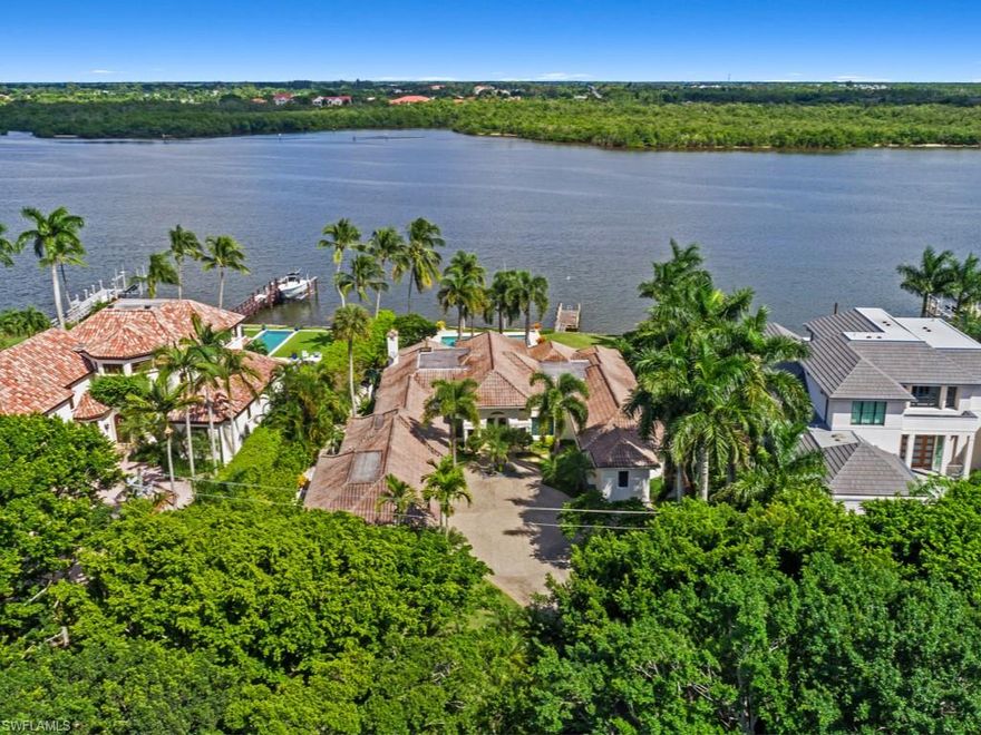 Rare find in Port Royal on Naples Bay. Amazing tropical setting with beautifully landscaped grounds, expansive patio and a large pool and spa with sweeping wide water views of the bay. This 4,876 square foot home has been completely renovated by A. Vernon Allen and features all impact rated windows and doors, travertine floors, extensive moldings, accent lighting, custom cabinetry, high ceilings, fantastic kitchen with large island and fine finishes throughout. This home has been meticulously maintained. Complete with 3 car garage.