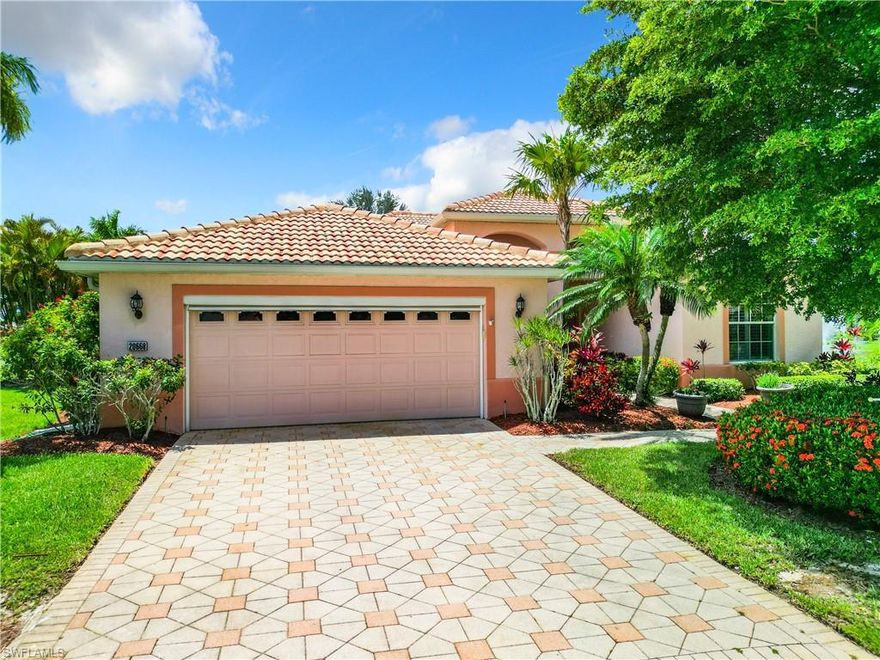 Spacious POOL HOME with THREE BEDROOMS on a lake in HERONS GLEN COUNTRY CLUB. This spectacular home has the rare combination of an exceptionally large lot on a quiet cul-de-sac, with a gorgeous lake view including TWO FOUNTAINS, PLUS a pool with SPILLOVER SPA, a POOL BATH and 3 full bathrooms, and 2,150 sq ft of living space including 3 true bedrooms. Space +Pool +View +Privacy…this home has it all!  Inside you will find recently installed luxury vinyl plank flooring everywhere except the bathrooms, plantation shutters, tall baseboards, and upgraded lights and fixtures throughout. You will especially love the FRAMELESS GLASS BAY WINDOW in the eat-in nook beside the kitchen. The kitchen boasts real wood cabinetry with a premium finish, granite counters, a breakfast bar, stainless appliances, and a WALK-IN PANTRY. The large master suite has a generously sized en-suite bathroom and TWO WALK-IN CLOSETS, the larger of which has built-in organization. There are three sets of glass doors leading onto the large lanai, which has a NEW CAGE in 2020 with TWO PANORAMA SCREENS to maximize your enjoyment of the exceptional view, including stunning SUNSET views in the evening. The NEW ROOF was installed in 2020, along with gutters and SOLAR POOL HEATING (warranty through 2032), which supplements the electric heater. There is a 2022 A/C system and accordion HURRIANE SHUTTERS THROUGHOUT. This house is a rare gem, and ownership affords you access to all of the amazing amenities, activities, clubs, classes and events that Herons Glen is known for! Call TODAY for your private tour!