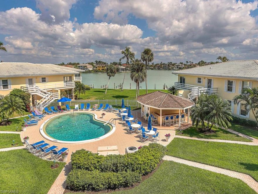 Beautiful Views of the BAY from this 3rd floor center unit! Perfect location in the building and carport directly across from the unit. This condo has been renovated with a beautiful kitchen, granite counter tops, tiled backsplash & bathrooms have been remodeled as well! The views of the Bay and the Pool are fabulous! Great opportunity to be in a such a great location! Executive Club is a hidden gem on GSBN with beach access across the street! This beautiful unit also has Impact Windows through out. Boat docks are owned by individual owners, however, there are owners who would be interested in leasing their dock to a purchaser. Executive Club is a 55+ building, and there IS NOT a land lease! Beautiful grounds and a low density complex. Your buyer will NOT be disappointed. It shows like a model!!! Easy to show!!! AND ONE CAN ALSO SEE THE GULF OF MEXICO FROM THE MASTER BEDROOM!