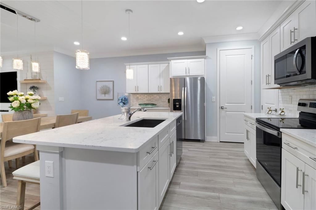 Photo of 12973 Pembroke DR, NAPLES, FL 34105 (MLS # 226010196)