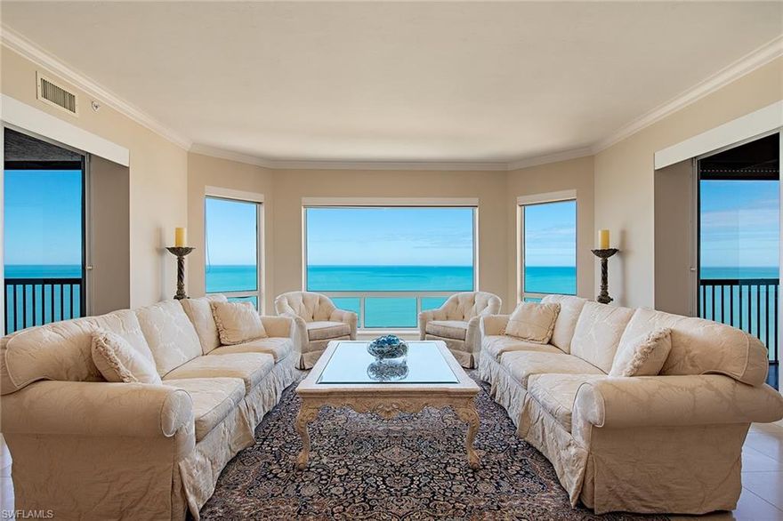 Gorgeous Gulf and beach views! Rarely available higher 03 floor plan directly on the beach in the private gated community of Bay Colony in Pelican Bay. Featuring panoramic views of the Gulf of Mexico through brand new impact glass picture windows and floor-to-ceiling glass sliders off both the breakfast area and master BR. This highly sought after design welcomes you into an elegant entry foyer and spacious living area boasting polished marble floors, elegant moldings, lighting & trim and a separate dining area. The open kitchen and den area offer plenty of room for entertaining family and guests including 2 full guest bedrooms, both with en suite baths. Extra storage closet in hallway and additional storage at garage level. The Biltmore amenities include an impeccably renovated lobby with 24-hour manned front desk, two guest suites, fitness center, social rooms, and a resort-style pool. Bay Colony residents enjoy the use of their own private newly renovated beach club and restaurant, a tennis club, as well as the use of the amenities of Pelican Bay. Private golf memberships are available separately. The Biltmore makes a perfect home for an unsurpassed Naples lifestyle!