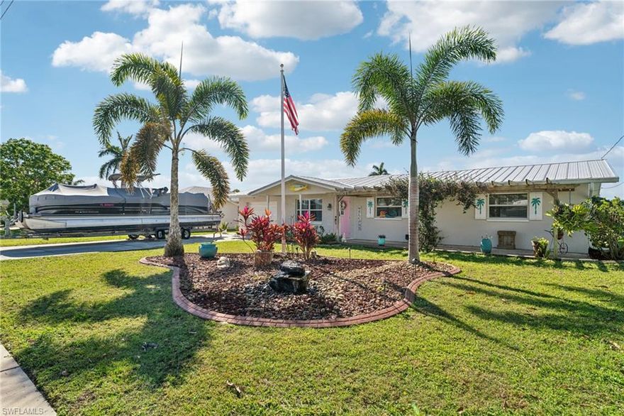Experience the ultimate in luxury waterfront living and true boating freedom in the highly desirable Waterway Estates, just one minute from the Caloosahatchee River. This beautifully updated home offers direct water access with a 7,500-lb electric boat lift, boat davits, and seawall, allowing you to cruise Southwest Florida’s waterways and Gulf Coast in minutes.

Designed for both relaxation and entertaining, the outdoor living space features a heated pool, cooling pool, and a brand-new six-person above-ground spa conveniently located off the primary suite. The expansive screened lanai wraps the pool and patio areas, creating a private, resort-style oasis ideal for year-round enjoyment.

Inside, the recently remodeled kitchen blends elegance and functionality with white shaker-style cabinetry, quartz countertops, a center island, ample storage, and brand-new stainless-steel appliances. New porcelain tile flooring flows throughout the home, complemented by modern ceiling fans and stylish solid wood three-panel doors.

The primary suite offers private lanai access and an en-suite bath with a walk-in glass shower featuring floor-to-ceiling tile. A bright Florida room with double-paned windows adds natural light and additional living space, enhancing the home’s open and airy feel.

Additional highlights include a durable metal roof, double-wide driveway, storage shed, and a peaceful waterfront setting in an established community with no HOA, no deed restrictions, no community fees, and no city taxes. Ideally located approximately ½ mile from Cape Coral city limits and about 3 miles from the Edison Bridge to Fort Myers, this home delivers luxury, location, and lifestyle—without added costs or restrictions.

This is Florida waterfront living at its finest—where elegance meets effortless boating.