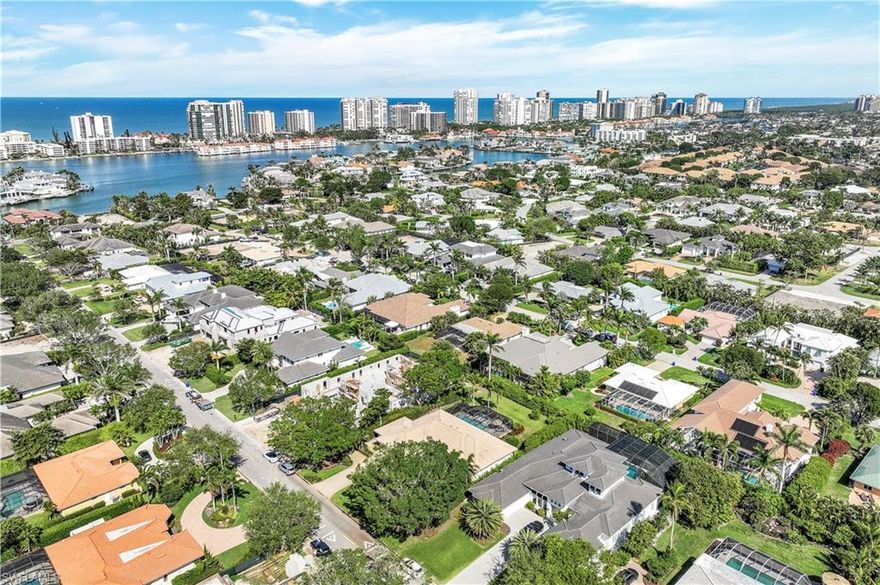 CENTRAL MOORINGS LOCATION! Beautifully furnished (furniture negotiable), 4 Bedrms/3 Baths, single family, one story, 3020 sq.ft. home ,with large heated pool & spa, extra large backyard for entertaining. Close to fantastic shopping and restaurants on 5th & 3rd Avenues, Venetian Village and Waterside Shops. Buyer will have access to Member's only private Moorings Beach Club, right on the Gulf of Mexico. Take a swim in the beautiful large pool & spa, or lounge outside in the extended lanai/patio, with a drink in hand, looking out at several palm & fruit trees in your own privacy. This is TRUE PARADISE!