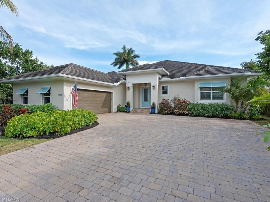 Location, location, location! Enjoy the Naples lifestyle, walking 15 minutes to downtown out the front door and keeping your boat on the 12k lift out back with no bridges all the way out to the Gulf of Mexico. Built in 2015 this over 3,000 sq/ft 4 bedroom, 4 bath, heated saltwater pool and spa home features upgrades throughout. The gourmet kitchen is perfect for entertaining with oversized island and Thermador appliances. 18' ceilings in the great room with water views. Some of the homes upgrades include: quartz and granite counters, high end cabinetry and vanities, tile showers, wood floors, built in outdoor grill and fireplace, power retracting screens, impact windows and doors, plantation shutters, mature landscape and custom closet systems throughout. Wonderful pool and canal views from the great room, kitchen, dining, guest, and primary.