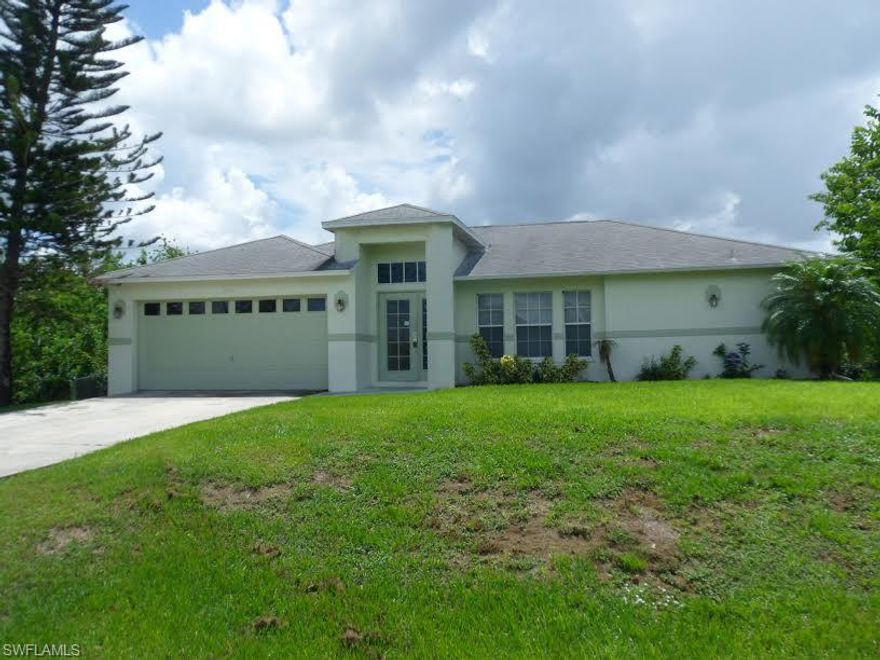 3 Bedrooms, 2 Baths, large screened lanai, ceramic flooring in all living areas, vaulted ceilings, pantry at kitchen, and much, much more all located on large, oversized lot with easy access to Lee Blvd.