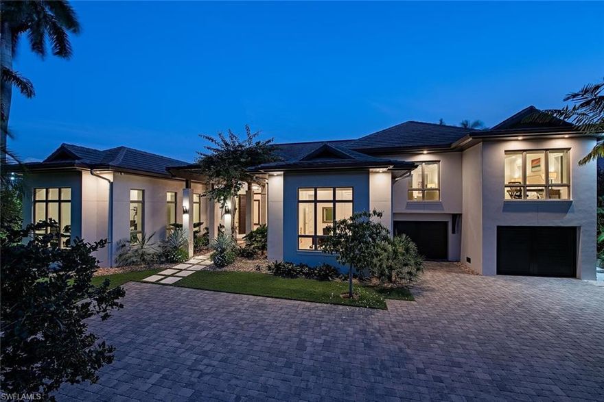 Exceptional custom Knauf Koenig built residence situated on an oversized south facing waterfront lot in Aqualane Shores. Created by Falcon Design this meticulously constructed and carefully thought out 2017 built home includes nearly 5,000 square feet of air conditioned space, 5 bedrooms, 3 car garage, 46’ lap pool/spa, Ipe dockage, two boat lifts (4,500 & 27,000lbs), quick deep water Gulf access, and unrivaled finishes. Some of the features include full concrete construction, natural gas supply, Ruffino cabinetry, generator, mud room, Elan G home automation, sound/security camera systems, 1,000 bottle temperature controlled wine room, Legno Bastone "Tropea" wide plank Oak wood flooring, extensive quartzite and natural stone countertops, Vantage low voltage lighting system, Lutron electric roll down shades, and an additional access to the upper 2 bedroom guest suite with lounge.  The outdoor space offers the ultimate resort lifestyle and includes a large covered outdoor kitchen space with Cypress T&G ceilings, large yard, and fire place complete with automated screen/shutter protection. Positioned in close proximity to Old Naples shops, fine dining, and Naples sugar sand beaches.