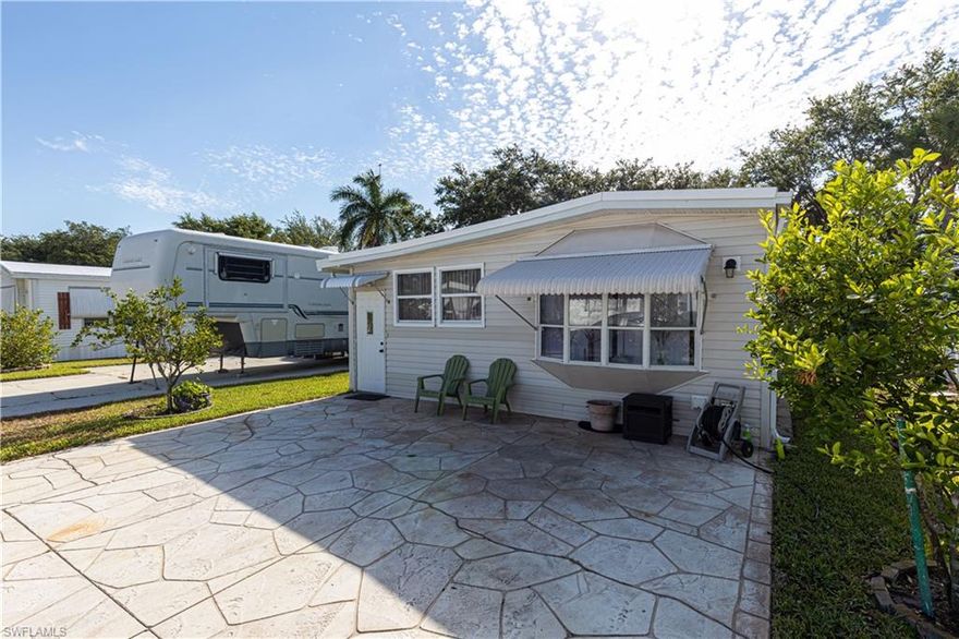 Welcome to Imperial Wilderness, an active, gated, 55 plus community where you OWN the land.  This home has very nice laminate floors throughout.  One of the nicer things is that it features an 80 gallon water heater, located in the 2nd bath. This is something that is not common in this type of home.  You can enjoy sitting on the paver pad in front, waving to your neighbors or enjoy the nice paver patio that overlooks a very peaceful green space. This home has many updates including a new roof in 2017, all new plumbing in 2013, new a/c in 2015, and newer electrical.  When you walk into the home, you immediately get the feeling of home with comfy furniture and lots of windows for light.  The kitchen is quite roomy and all set for enjoying family time when they come to visit.