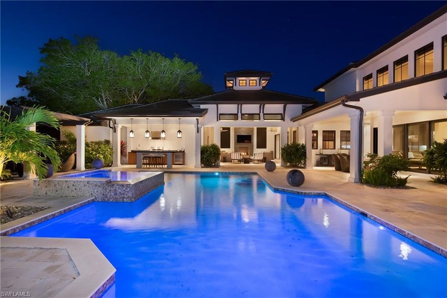 This home is designed for easy living and gracious entertaining.  This 3 bedroom plus den, and 5 baths, also offers a flex room that can be a den or bedroom.  The gourmet kitchen, with gas range, sub zero refrigerator, wine cooler, and ice machine, make cooking a pleasure.  The butlers pantry, with sub zero drawers, are great when guest visit.  As soon as you enter the home, the outdoor space welcomes you, with two large covered lanais, remote screening, outdoor fireplace, summer kitchen with warming drawers, heated pool & spa, and water feature.  The private, oversized home site, feels like you are at a resort.  The home was designed and furnished by the award winning designer, Rene Gaddis, with outstanding attention to the finest finishes.  The side entry, 3 car garage, with finished storage, are just one of the many outstanding features this home has to offer.  You will also enjoy the desirable location, close to shopping and dining, and private beach access.  Naples living at it's best!