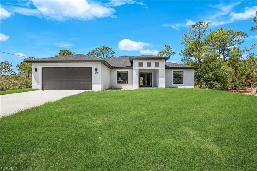 Sabel Palm Model home on half an acre
4 bedroom 2 bath 2 CAR Garage -with epoxy floors new construction home in Lehigh Acres Florida.  plenty of space for the whole family. The separate dinning and living rooms can also be used as flex spaces. The vaulted ceilings, hurricane rated windows and doors and extra large garage on this half acre lot set this home apart from the others.  Primary bedroom is 14 X 17 and has two walk in closets the bathroom has separate tub and shower and two sinks.  A split floor plan offers 2 bedrooms that share a bathroom and another bedroom. Great room is ready for a large TV with a wood feature accent wall. Kitchen has all stainless appliances, a large granite island and a nice sized dinning area for your everyday meals. Formal dining room off the kitchen.