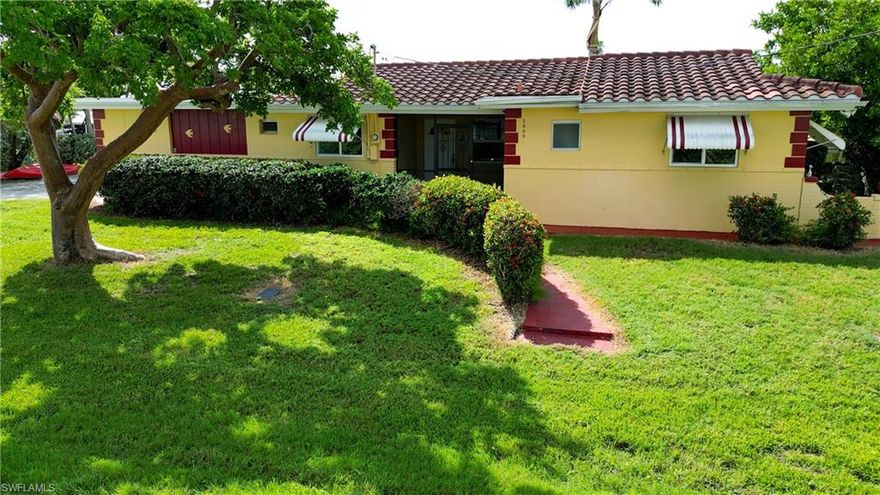 Move In Ready Island Home on Over 100 ft of Deep-Water Access! Sitting on a HUGE lot this 2-bedroom classic island home is ready for occupancy now! Located 2 lots from the end of the canal this home features great views of Matlacha Pass. Nestled in the heart of Matlacha, the location of this home is everything and more that someone who loves the water could hope for! World renowned fishing, beautiful white sand beaches and the Calusa Blueway Kayaking Trail are all right at your fingertips when you reside in Matlacha. Matlacha Pass is also home to abundant native wildlife including dolphin families and manatees that are frequent visitors to this property. This super cute island home has been thoughtfully renovated while preserving some of the original characteristics including a very cool brick accent wall in the main living area. As soon as you walk into the home a serene feeling overcomes you when you are met with canal and Matlacha Pass views from the wall of oversize windows that make up the back of the home. The galley style kitchen has been completely renovated and updated including new cabinets, stainless appliances, quartz counter tops and even a built-in wine rack! Wood plank tile is throughout this home providing a neutral base for any style of decor. The full bath has been updated as well featuring gorgeous tile work in the walk-in shower, new vanity but keeping the original light fixture to preserve the charm of the era the home was built. The back room has impact windows and can be used as a den, office, artist's studio or whatever your needs for extra space are! This home features a 1 car garage complete with a half bath. The outdoor living spaces of this property are superb! The screened in back porch is the perfect place to start the day with coffee and sunrise or unwind from the day with happy hour and one of the iconic Matlacha sunsets! On the west side of the home there is a coral rock patio that is shaded by a mature tree providing an ideal spot for a hammock! The oversize lot has plenty of room for a pool and features a boatlift and dock area complete with a kayak launch dock. Mature Royal palms in the backyard really complete the island vibe! Do not sleep on this property, now is the time to get into Matlacha! Come see this home today and start Living the Island Life!