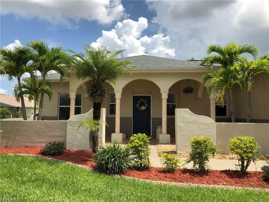 IT IS ALL ABOUT LOCATION, LOCATION. This remarkable, updated home is located in a quiet, desirable neighborhood near good schools, shopping, sidewalks and bike paths. It also can be financed with your custom built pool if you are looking for a pool home and want the pool to your specifications.  The kitchen has been updated with new stainless appliances, new interior and exterior paint, new carpet, updated master bath shower, new 16 sear air conditioner, new 50 galllon water heater, automatic irrigation system, security system, matured landscaping and 10 foot high ceilings makes this home move in ready. Come see this opportunity to live in beautiful Cape Coral and enjoy the Florida lifestyle that you have been dreaming of in a home.