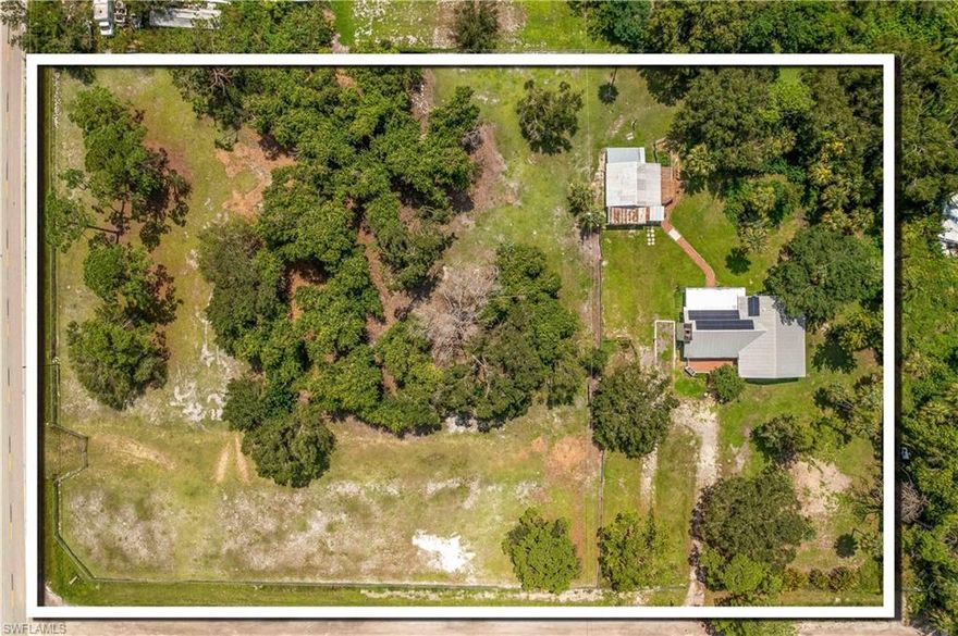 PRICE IMPROVEMENT! This beautiful 3 bed/2 bath country home sits on over 3 ACRES and includes a 5' fence, gated entry and barn/workshop.  Enjoy the relaxing country setting while being only minutes from I-75.  Bring your horses, the Posse arena is just around the corner.  Sit back and take in the gorgeous brick fireplace, enclosed lanai and large front deck.  AC 2021, New well pump, Metal Roof 2005 - comes complete with solar panels (2022), propane cooking and so much more! HOME WARRANTY INCLUDED with the sale. Don't take my word for it, schedule a showing today.