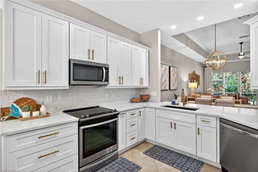 SENSATIONAL AT THE SANCTUARY!! With its ABSOLUTELY STUNNING RENOVATION and striking furnishings this "Pelican Model" villa at popular Blue Heron is sure to please! Highlighting the home is a gorgeously remodeled kitchen with new white shaker style cabinets accented by soft brushed gold hardware, custom white picket fence backsplash, upscale faucet, modern undermount sink, eat-in breakfast nook and more!! Additional features include fresh interior paint, ALL IMPACT RATED WINDOWS AND DOORS, knock your socks off designer fans and light fixtures throughout, soaring tall ceilings, tray ceiling in family room and master bedroom, crown molding, wide open floor plan with 4 panel sliding doors open to views of the sanctuary preserve, tile throughout with new wood-look tile floors in all bedrooms and a super convenient whole house generator! Continuing you will find a gorgeous master suite with bay window and 2 walk-in closets highlighted by a spa-like, completely renovated en-suite master bath re-configured to allow for a "wow factor" walk-in shower, dual sink vanity and large linen cabinet! This home also offers a large guest bedroom, completely remodeled guest bath with combo tub/shower, large den with lounge and murphy bed that could double as a third bedroom or home office, and a spacious laundry room with beautiful upper cabinets! As for the outside, enjoy a large screened and covered lanai with new wood look tile floors overlooking the peaceful sanctuary preserve, desirable 2-car garage, beautiful landscaping, manicured common areas and more! Blue Heron is a gated enclave located close to the area's best shopping, restaurants, entertainment and Naples' award-winning white sand beaches with parking passes available for Collier County residents! Blue Heron residents also enjoy a clubhouse with pool and fitness center, tennis, pickle ball and an active social calendar. Call for your private showing today!!