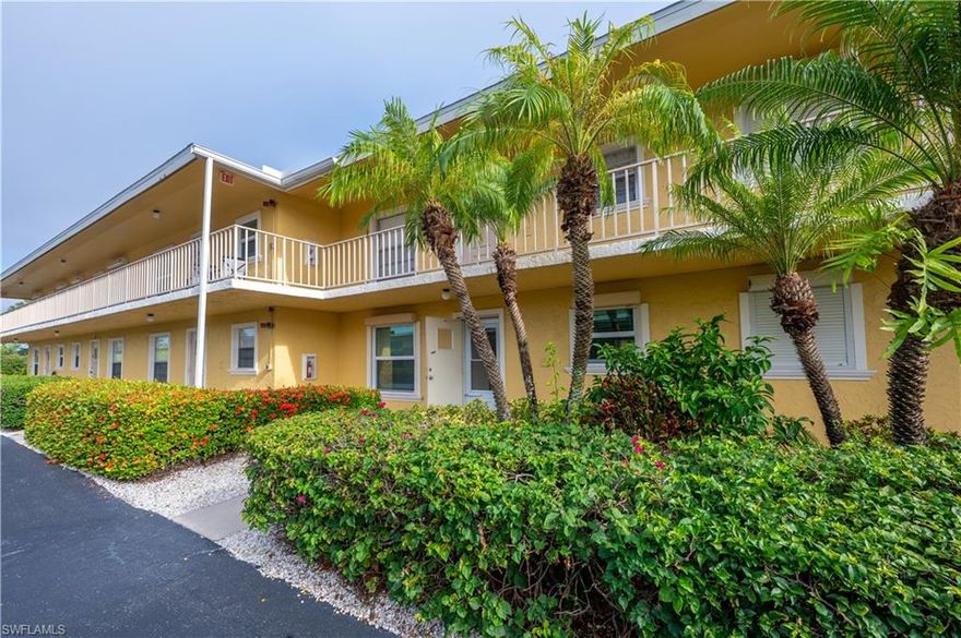 Welcome to this immaculately maintained first-floor 2-bedroom, 2-bath condo in a vibrant 55+ community! Just 5 miles to Naples beautiful pristine beaches, yet far enough inland to dodge any storms. (Zone D) This unit features impact windows. Enjoy the light and bright living space all day long, as the unit faces the pool without late afternoon harsh direct sunlight. Convenient parking is just steps from your front door, with plenty of extra spaces for guests. You also have separate storage space for your beach and seasonal items.  The community offers poolside social gatherings, BBQs, and a fun chickee bar. For the handy residents, there's a community workbench with shared tools, ladders, and more. This well-balanced community offers the perfect blend of privacy and neighborly connection.