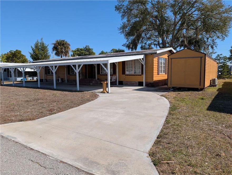 This spacious 3-bedroom, 2-bath home offers 1,448 sq ft of living space and sits on the largest lot in the community—a rare double 100’ x 100’ parcel in the pet-friendly 55+ community of Forest Park. You own the land and pay just $192 per month, which includes WiFi and access to all community amenities. The property also includes an $8,000 shareholder value.

Major updates include a 2019 roof and an extra-large 50’ x 20’ carport added in 2023. The home features newer mini-split A/C systems (2020–2023) in each room, allowing for individualized temperature control throughout. Subfloors and flooring were replaced in 2019, and the water heater is approximately 3 years old.

Storage is exceptional with multiple outbuildings: a 10’ x 6’ shed with washer, dryer, and storage, a second 10’ x 6’ workshop shed, and a permitted and anchored 30’ x 8’ aluminum shed with mini-split A/C—perfect for a guest suite, man cave, or in-law space. All sheds are accessible via a covered walkway, and there is even an outdoor shower with hot water. The backyard features mango and banana trees and overlooks a canal with a fountain, adding to the peaceful setting.

With major systems already updated, a little cosmetic updating could transform this into an incredible property with hard-to-find space and storage.

Forest Park residents enjoy a relaxed, social lifestyle with amenities including a clubhouse, community pool, sauna, bocce, shuffleboard, billiards, and a putting green. Planned events make it easy to stay active and meet neighbors. The community also offers free storage for RVs, trailers, and boats.