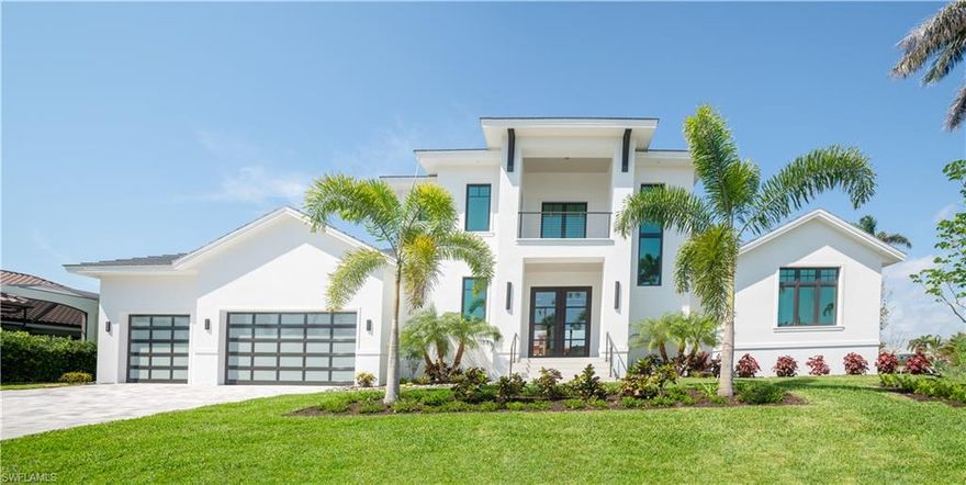 Get ready to enjoy this spectacular custom residence built by renowned BRAUN builders! This two level,4 bedroom,4 1/2 bath home has all the upgrades, just waiting for a buyer's personal touches. Prestigious Estate neighborhood, this property features 184' of direct access waterfrontage, new seawall, dual boat lifts plus jetski dockage. Quick direct boating access to the Gulf of Mexico via Robert's Bay.  Gourmet kitchen features custom cabinetry, stainless Thermodore appliances, plus gas cooking (500 gallon inground propane tank also services Generac generator, outdoor patio kitchen and grill) Designer staircase features custom built wine storage perfect to display your personal wine collection! Tile and hardwood flooring throughout, dual laundry facilities on both floors for your guests' convenience. Balconies abound! Master bath features dual vanities, walk-in shower and separate tub. Upstairs offers an expansive bonus room with wet bar for entertaining. Home living areas flow seamlessly into an ''Open Concept'' lanai, pool, spa and outdoor entertaining area with Robert's Bay views, ideal for indoor/outdoor living. Three plus car garage. Three AC zones, Generac generator, Hurricane sliders and automated shutters. Landscape design by renowned local architect Dan Isaacson. This residence is one of a kind, just awaiting your family's enjoyment and lifestyle! Enjoy the view of Roberts Bay!!!Robb and Stucky furnishings available for purchase