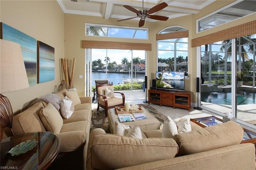 Escape to your direct-access, bayfront retreat with panoramic views of Tarpon Bay from nearly every room. The island-chic, former Islander-DIVCO model with three bedrooms, three baths, plus den has been beautifully updated and comes complete with designer furniture. The warm and inviting modern residence has clean lines, simplicity and a palette of soothing neutrals and crisp whites, which complement the open, light and bright floor plan. Enjoy watching the tarpons roll on the bay or relax and soak in the hot, Florida sun from your spacious screened lanai with travertine floors and heated saltwater pool with waterfall feature. Great docking facility with nearly 90 feet on the bay and near-immediate access to the Marco River, area backwaters, world-class fishing and area wildlife viewing. Move right into your piece of Marco Island paradise, just bring your suitcase!