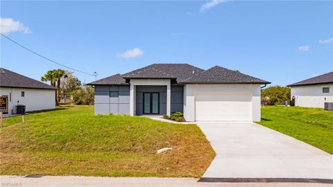 Photo of 817 Frederick Reid ST E, LEHIGH ACRES, FL 33974 (MLS # 226037891)