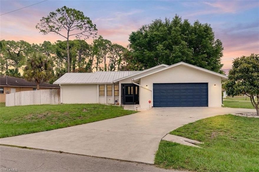 Welcome to 300 Edward Ave - where comfort, style, and immediate move-in convenience come together on an oversized corner lot in Lehigh Acres. With mature landscaping, added privacy, and valuable upgrades already completed, this home offers warmth and character that’s hard to find.

Step inside to enjoy luxury vinyl plank flooring, abundant natural light, renovated bathrooms with granite countertops, and a stylish kitchen featuring white shaker cabinetry, marble countertops, stainless steel appliances, and generous prep space. French doors open to a spacious screened lanai, creating the perfect indoor-outdoor flow for relaxing or entertaining.

The air-conditioned garage conversion offers flexible space for a home office, gym, guest room, or playroom- an added feature not commonly found in many homes! Additional improvements include a metal roof and gutters installed in 2023, new fencing, and a newer A/C system.

The oversized corner lot also features mature mango, avocado, apricot, and ackee trees, creating your own tropical oasis. Conveniently located near Lee Blvd with quick access to shopping, dining, schools, Fort Myers, RSW Airport, and Gulf beaches. If you’re searching for a move-in ready home with upgrades, outdoor space, and a convenient location, this one is a must-see. Schedule your private showing today!!