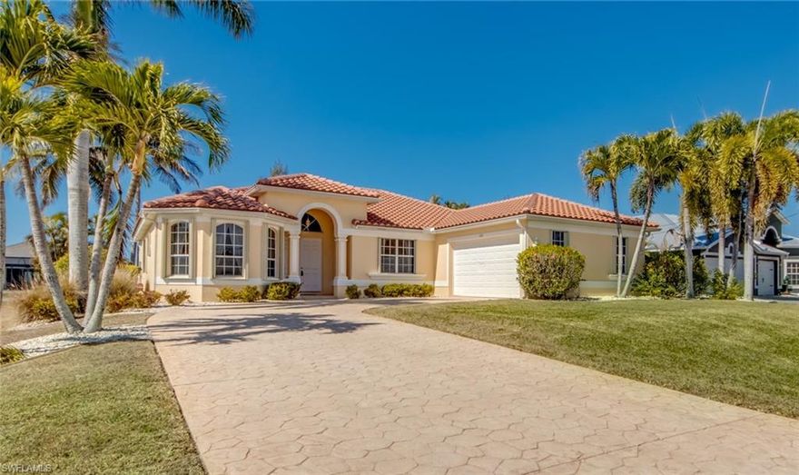 If you desire a home that provides the TRUE ESSENCE OF FLORIDA LIVING, you have found your piece of PARADISE! This beautiful residence boasts a multitude of charm and creature comforts that will have you "living the good life". From the moment you pull up in the driveway, you'll notice this home has a little bit more to offer than all the rest. *TURNKEY and FULLY FURNISHED with over 2000+ sq. ft. of living area, 3 bedrooms, 3 bathrooms, spacious side loading garage, and a BRAND NEW Tile Roof *HEATED POOL and INTEGRATED HOT TUB surrounded by a large, screened pool deck offering ample space for lounging in the sun or entertaining guests *Enjoy beautiful sunsets and a variety of marine wildlife behind the house along the 80' OF FRESHWATER CANAL FRONTAGE with SEAWALL *Abundant natural light throughout the home through the large solar tinted windows and 8' tall sliders (all protected with EASY TO USE ACCORDION SHUTTERS) and ELECTRIC ROLL DOWN SHUTTER for the under truss lanai. *UPGRADED KITCHEN with 42"+ wood cabinets, granite counters, refreshing reverse osmosis filtered drinking water at the sink, high quality matching appliances, and tons of cabinet space. *Tile and laminate flooring throughout the home, crown molding, and decorative window coverings add an elegant touch to every room *Utilities and assessments are IN AND FULLY PAID *Home has never flooded and DOES NOT require flood insurance. Beautifully landscaped, decorative landscape stone, continuous curbing, stamped concrete driveway, this home is a STUNNER and one you'll be proud to call yours. It also has ENDLESS POTENTIAL as a SEASONAL RENTAL property. It has "the look" and every creature comfort a tenant would desire for their vacation retreat.  BONUS FEATURE, this home is fully wired and plumbed with all the components for whole house solar electric panels and solar pool panels (only 4 years old) which are included in the garage. Be sure to put this one on your list, you will not be disappointed!