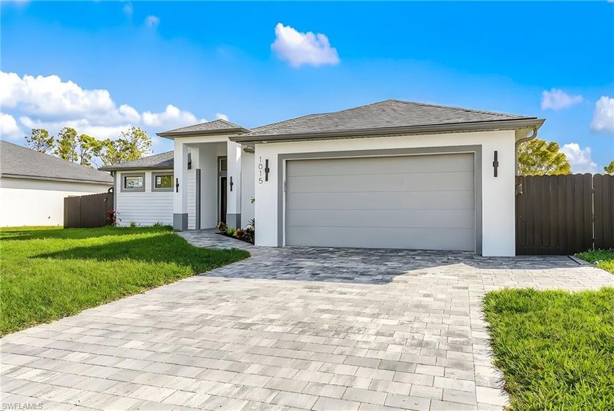 Welcome to this stunning new construction single-family home located at 1015 SW 8th Ct in Cape Coral. This modern residence features sleek architectural design, high-end finishes, and an open layout perfect for contemporary living. Enjoy Florida living at its best with a private pool, summer kitchen, expansive pavered outdoor space, and a seawall ideal for relaxing or entertaining. Connected to city utilities with no assessments, this home offers both luxury and peace of mind in a prime location.