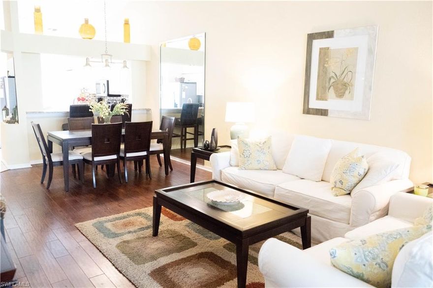 This tastefully decorated three bedroom, 2 bath home with high vaulted ceilings and 2 car garage will impress the most discriminating buyer. Totally move in ready located in a prized area of Naples!  Relax with ease and comfort with newer wood floors and tile throughout, new roof (2018), kitchen with stainless steel appliances, granite counters and tile backsplash, Hot-water heater (2018), Trane HVAC unit with replaced ducts (2018), laundry, pantry, attic storage, make this selection hard to resist! The Master bedroom dual-vanities, walk-in closet. Guest bath includes a walk-in shower.  This is one of the very few properties in the Royal Villa's with the large, extended lanai! There's no lack of fun activities with a beautiful, large lake, lighted tennis courts, jogging path, heated swimming pool, and inviting country club or just take a dip in Royal Circle's own community pool! This immaculate home is perfectly situated close to shopping, Naples famous downtown area, beautiful beaches, and I-75!