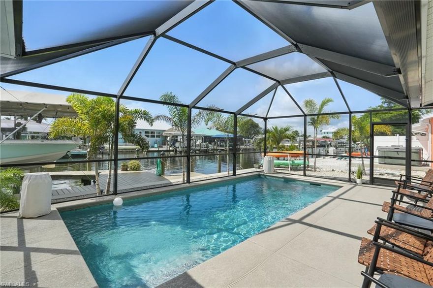 WATERFRONT FISHERMAN’S DREAM HOME – DEEP CANAL ACCESS, 13,000 LB BOAT LIFT & NEW SALTWATER POOL!

Welcome to your ultimate fishing and boating paradise—perfectly located on one of the widest, deepest canals on the island with direct Gulf access just minutes away! Whether you’re chasing redfish at sunrise or watching dolphins from your backyard, this angler’s retreat checks every box.
Enjoy a fully updated coastal home with a modern kitchen featuring brand-new waterfall granite countertops, a coffee bar, roll-out pantry shelves, and thoughtful built-ins. The open layout offers waterfront views from the main living areas and the primary suite, creating the perfect blend of comfort and scenery.

Outdoors, notice the home rests on a rise. Designed for low-maintenance, high-reward coastal living. Highlights include:
Built in 2023- heated saltwater pool with water leveling and self-cleaning system, also a screened pool enclosure |Built in 2020- 13,000 pound boat lift with canopy | Tiki Hut w/ power & water | Captain’s walk, kayak launch, and composite dock with underwater fish light (turns the canal into an aquarium)| New seawall in 2020 | Superior storm protection | No HOA | No rental restrictions | A laid back community known for its friendly island vibe, much like Key West!
The fishing and boating opportunities here are unmatched—drop a line right off your dock or be in open water in minutes. Tarpon, snook, redfish, and trout are all within easy reach. Plus, with ample parking (2 concrete driveways flank the home- a double and single), there's plenty of room for your truck, trailer, golfcart, or RV.

Ideal as a primary home, vacation getaway, or high-yield rental investment—weekly rental income ranges from $4,500 to $7,000+ in peak season. This home is located in a neighborhood featured on HGTV’s Beachfront Bargain Hunt, and for good reason: the laid-back island lifestyle and unmatched water access. Matlacha is not subject to Cape Coral rental regulations.

Don't miss your chance to own this Florida fishing home for sale—move-in ready!

Schedule your private showing today and get ready to live the boater’s lifestyle you've always dreamed about soon!