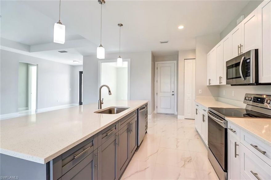 Home is Ready!  Elegant Brand New Construction at a great price in Golden Gate Estates Ready for a family to enjoy. Best of all…No fees No restrictions! As you enter you will feel right at home!  Open floor plan with plenty of light throughout.  Many upgrades such as 8’ doors, Carrera polished porcelain tile throughout, a beautiful kitchen with an island, soft close wood cabinets, quartz counter-tops stainless steel appliances and a pantry.  Huge master with a shower and jetted tub to relax after a hard day at work!  You will be delighted in the Large size laundry room with wood cabinets and quartz counter-top.  This home has 3 bedrooms plus a den, 2 bathrooms, 1,897 sqft under air, sprinkler system and sits on a beautiful 100% upland 2.71 acre lot. Plenty of space to build a pool, guest house in the future, a workshop, bring your RV, trucks,  have animals or just sit and relax at your screened lanai in the morning with a cup of Joe listening to the serenity all around.  Close to the new Publix the new Charter School as well as high school, middle and elementary! Don't delay...at this price this home will go FAST!