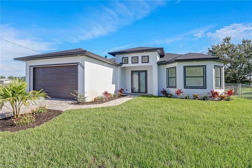 Beautiful custom home in Lehigh Acres with split open concept . This fenced 4/BED 2/bath  two cars garage house comes with tile floor throughout entire property as well as paved driveway. The living area is an open space with remote controlled ceiling fans as well as in the bedrooms and patio . The kitchen has a modern design with a spacious island , countertop and backsplash with quartz , white cabinets , stainless steel appliances and an  integrated pantry. Washer and dryer are included in the sale. The master bathroom comes with dual sinks and  quartz on vanities alone with a large walk-in  shower. USB electrical outlets throughout the house. This house is located only few minutes from RSW international airport in one of the best areas in Lehigh Acres