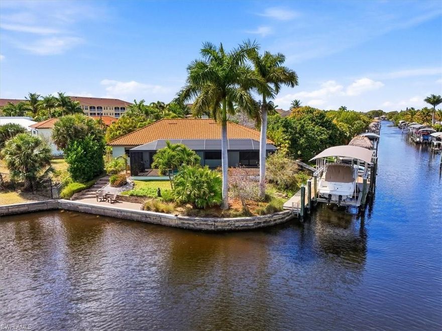 Tucked at the end of a quiet cul-de-sac on a corner waterfront lot, 2105 Ottersrest Lane
is one of Cape Coral’s most versatile and well-equipped properties — a custom-built
Cat 5 home set within Gold Certified Florida-Friendly grounds where birds, butterflies,
and fruit trees thrive without a drop of pesticide. Direct, no-bridge Gulf access five
minutes to the Caloosahatchee River, sweeping preserve views, and a garage portfolio
that collectors dream about.
On the water: a composite dock with a sunrise-facing Captain’s Walk overlooking The
Preserve at Four Mile Cove, a remote-enabled 16,000 lb boat lift with 34’ canopy, and a
remote-enabled kayak platform convertible to a jet ski lift. Deep water, sailboat access,
no fixed bridges.
The attached 3-car garage spans 862 sq ft and is fully climate-controlled with its own
mini-split. The adjacent lot adds a brand-new detached workshop: car lift, 560 sq ft, 14’
ceilings, oversized 14x12 door, and its own 200-amp service — with green space to
spare.
The 2,032 sq ft home offers 3 beds, 2 baths, and a remodeled kitchen anchored by an
oversized baker’s island with built-in microwave and mixer cabinet — genuinely built for
entertaining. Corner sliding glass doors open the living area fully to a 1,040 sq ft
screened lanai and propane heated saltwater pool, dissolving the line between inside and out.
Major systems replaced throughout: stone-coated steel roof, whole-house A/C, tankless
propane water heater, pool pump with propane heater and color LED lights, whole-
house water softener, and R.O. drinking system. Storm-ready with a 12k dual-fuel
generator on a 250-gallon in-ground propane tank with utility meter connection. This
home has never flooded. All utilities are underground.
Smart irrigation, rain barrel collection, WiFi-enabled outdoor controls, and a thriving
orchard — mango, avocado, papaya, banana, and lemon — complete a property that is
genuinely hard to replicate in this market.
Attached please find floor plans, elevation certificate and list of property features.
Schedule your showing today.