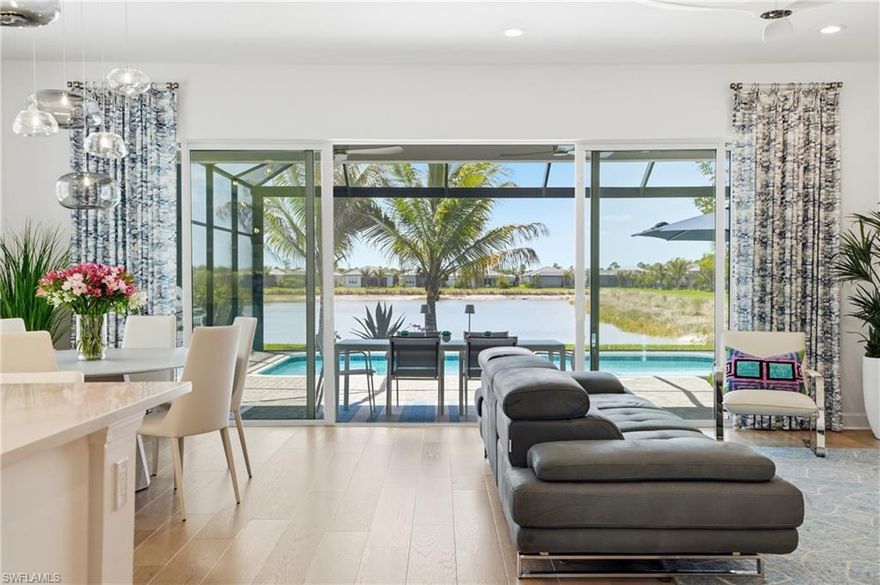 Breathtaking long lake views take center stage at 12352 Dahlia Court in Valencia Trails, setting a serene and picturesque backdrop for this beautifully designed residence in Naples’ premier 55+ luxury lifestyle community.

This beautifully maintained 3-bedroom + den, 3-bath home is light, bright, and thoughtfully updated, offering a spacious open-concept layout ideal for both everyday living and entertaining. Sun-filled interiors, soaring ceilings, and elegant finishes create a warm yet sophisticated atmosphere throughout.

The gourmet kitchen is the heart of the home, featuring sleek cabinetry, quartz countertops, a breakfast bar, and premium appliances—perfect for casual dining or hosting gatherings. The adjoining living and dining areas flow seamlessly to the outdoor space, enhancing the home’s inviting feel.

Step outside to your private screened-in lanai, complete with a sparkling in-ground pool and stunning long lake views—an ideal setting for entertaining guests or relaxing in the Florida sunshine year-round.

The luxurious primary suite offers a peaceful retreat with a spa-inspired bathroom and generous closet space. Two additional guest bedrooms and a versatile den provide flexibility for visitors, a home office, or hobby space.

Located within Valencia Trails, residents enjoy access to world-class amenities including a resort-style clubhouse, pool, fitness center, tennis and pickleball courts, on-site dining, and a vibrant social calendar.

Light-filled, move-in ready, and designed for entertaining—this exceptional home offers the very best of Naples luxury living.