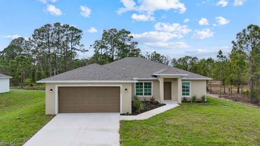 Welcome to this beautifully designed new construction home offering 2,030 sq ft of living space with a modern open-concept layout and high-end finishes throughout. This spacious residence features 4 bedrooms plus a den/bonus room, 3 full bathrooms, and a 2-car garage, providing flexibility for families, guests, or a home office setup.
As you enter, you are greeted by expansive living areas filled with natural light, enhanced by large windows and sliding glass doors that seamlessly connect indoor and outdoor spaces. The home features tile flooring throughout, delivering both a sleek, contemporary look and easy maintenance.
The kitchen is thoughtfully designed as the heart of the home, featuring a large center island, ample counter space, and custom cabinetry. The open layout flows effortlessly into the dining area and great room, making it perfect for entertaining or everyday living.
The primary suite offers a private retreat with generous space, walk-in closets, and a beautifully finished bathroom complete with dual vanities and a spacious walk-in shower. Additional bedrooms are well-sized and thoughtfully positioned to provide privacy and comfort for family members or guests.
A standout feature of this home is the bonus room/den, offering endless possibilities for a media room, office, playroom, or additional living space. The covered lanai extends your living area outdoors, providing a relaxing setting to enjoy Florida living year-round.
Built with durability and efficiency in mind, this home includes impact-resistant windows and doors, offering added protection, energy efficiency, and peace of mind.
The functional layout also includes a dedicated laundry area, ample storage, and a well-designed flow that maximizes space and usability.
Situated on a spacious lot in a growing area of Lehigh Acres, this property offers privacy while still being conveniently located near shopping, dining, and major roadways.
This home combines modern design, quality construction, and practical living spaces—making it an excellent opportunity for homeowners or investors alike.