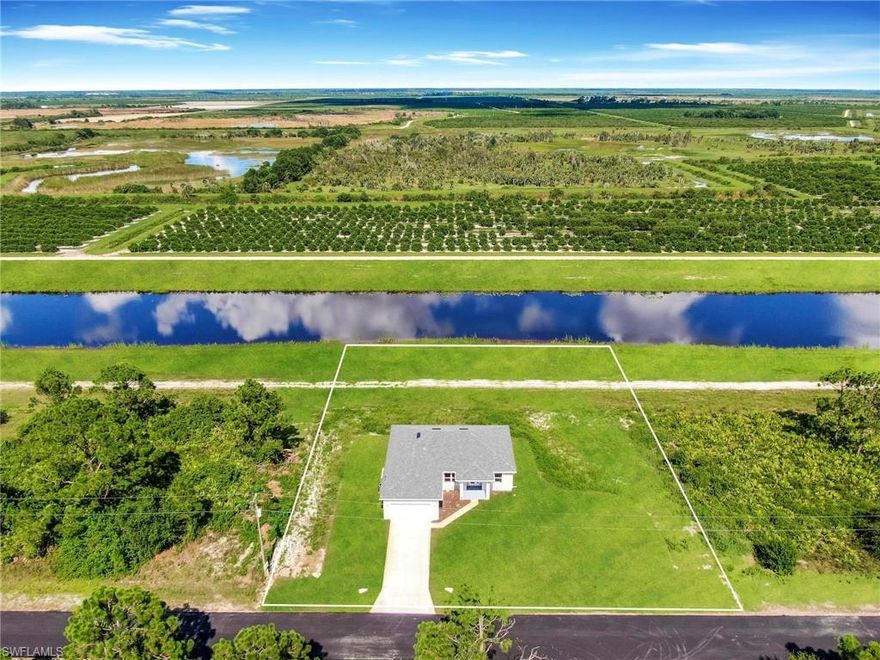 Prime Location!!! Quiet dead end street, very private where kids and pets can play.  This wonderful  brand new  Single Family Home sits  on a 0.46  acres of extended land,  features nearly  1,600 Sq. Ft of living space, 3  bedroom,  2 Full  new bathrooms with granite, 2 car garage. Freshly painted inside and out, new kitchen with self-close cabinets, granite, new stainless steel appliances, new doors, new based boards,  new  AC system, new light fixtures, new plumbing, new smoke detectors, alarm system new water heater, new well equipment. Home is equipped with Taex built-in pest control system, irrigation system,  hurricane impact doors and windows, Spacious master bedroom, new master bath, 2 walk-in closets,  new  tile throughout. Enjoy the privacy and tranquil surroundings with a canal view while being near SR 82, I-75, and Fort Myers,  NO HOA Fees. This home will not last!