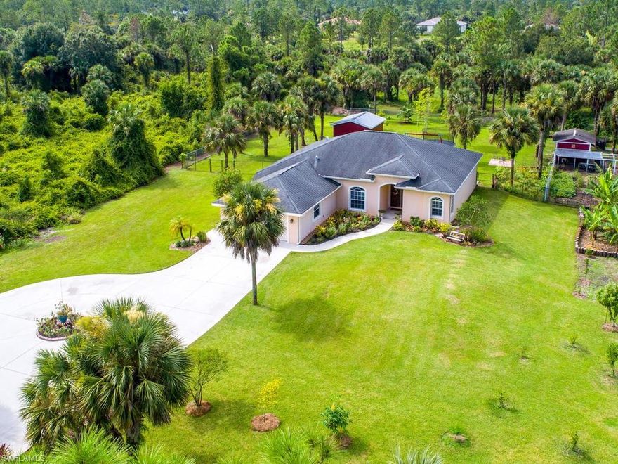 This beautiful Estate Home sits on 2.5 acres of tropical paradise! The inside features 3 Bedrooms (plus Den) and 2 Bathrooms, upgraded kitchen & counter tops, open floor plan, high tray ceilings, central vacuum system throughout, surround sound speakers, large 2 car garage, new AC in 2019, and a 5 STAGE WATER FILTRATION SYSTEM FOR THE WHOLE HOUSE! Outside includes a large fenced in backyard with a large storage shed, raised flower beds, hand built wooden swing set, garden bed, chicken coop, and over a dozen different fruit bearing plants & trees including coconut, avocado, mango, papaya, starfruit, oranges, lemons, neem, banana, plantain, & dragon fruit. As you drive up the extended cement driveway you are greeted with a field of multi-color wildflowers on the left and beautiful fruit trees on the right. So whether you have a growing family and are looking for the perfect place to make lasting memories or want that perfect private vacation home when you need to get out of town this home is for you.