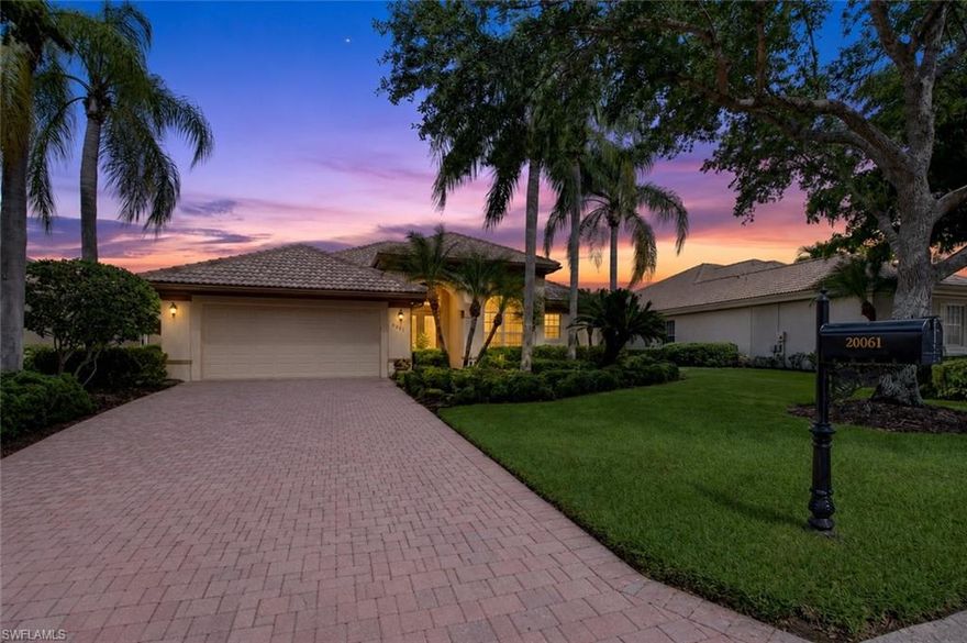 Tucked at the end of a quiet cul-de-sac with no through traffic in the Cypress Cove subdivision of Grandezza, this three-bedroom-plus-den, two-bath, two-car-garage home delivers 2,207 square feet under air on a premium estate lot where privacy and panoramic views come standard. An extra-long pavered driveway leads to a custom insert front door standing eight feet tall, setting the tone before you ever step inside. The interior is filled with natural light, accented by crown molding, tile floors throughout the main living areas, and a tray ceiling in the formal dining area. Premium electrical with upgraded Wi-Fi-controlled lighting — including under-cabinet lighting in the kitchen — allows effortless ambiance at the touch of a phone. The kitchen features Corian countertops and a full LG appliance package installed in 2024. The den is framed by eight-foot door casings, and French doors with glass inserts connect living spaces with elegance and warmth. The primary bath offers a glass shower and Roman soaker tub, and the laundry room includes extra storage cabinets, a hanging rack, and a sink. This home has been continuously updated — bedroom carpets replaced in 2023, a new Trane HVAC in 2021, roof replaced in 2022, and a fresh interior paint job in 2026 — giving the next owner years of worry-free ownership. Step outside to a massive 457-square-foot covered lanai and what is arguably the largest heated saltwater pool and spa in the neighborhood, complete with sheer descent waterfall features and a stunning view across an expansive lake to the 16th hole in the distance. Breathtaking landscape lighting on the front and rear is set on a photocell automatic timer, bringing the property to life every evening. The street itself is lined with canopy trees rarely found in Southwest Florida, creating a sense of arrival most neighborhoods cannot offer. Grandezza provides optional golf and social memberships unlocking a resort-style pool with full-service cabana, multiple dining venues, tennis, fitness, and a vibrant social calendar — premier golf community living without mandatory fees. Internet and cable are included. Perfectly positioned in the heart of Estero between Naples and Fort Myers, with easy access to RSW Airport, Hertz Arena, Gulf Coast Town Center, Coconut Point, Miromar Outlets, and the Gulf's white-sand beaches.