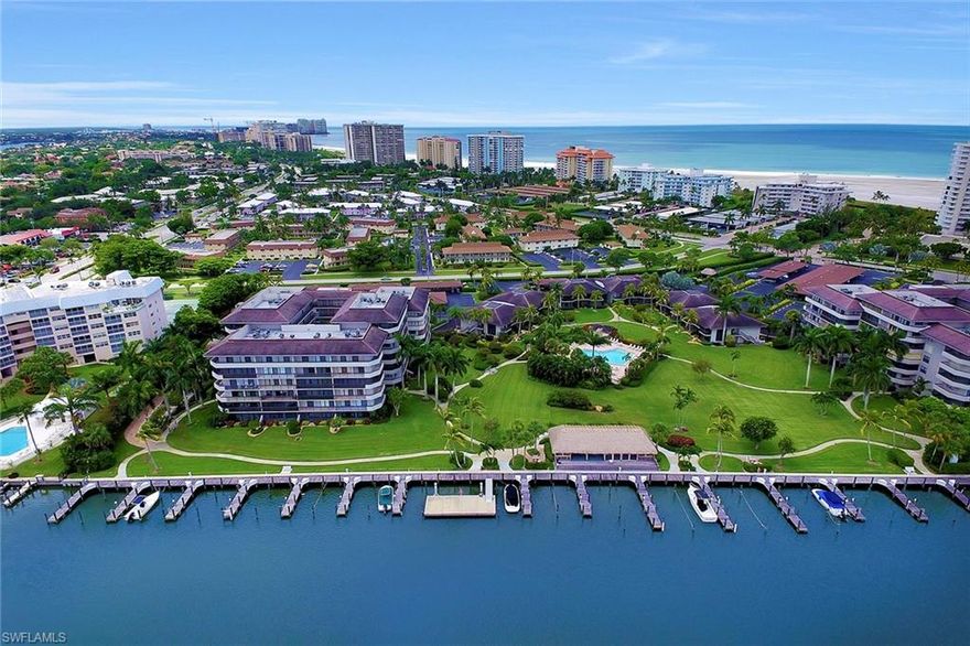 Fabulous condominium with sweeping wide water views of the bay, docks, pool and lush tropical landscaping. This light and bright, beautifully decorated condominium, has custom updated kitchen and baths with quartz, diagonal tile floors in main living area, stainless steel appliances, upgraded recessed lighting, wide base casings, extra lanai storage, plus a carport that includes additional storage. Boardwalk beach access, pool, common docks, tennis, bocce, pickle ball, shuffleboard and BBQ area, are all an added bonus within this gated community of South Seas Club. Linger on Marco Island’s sandy beach or lounge poolside, take advantage of the shade under the Tiki hut and just enjoy the carefree, laid-back lifestyle of the island.