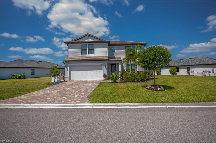 This impressive 5 bedroom/4 bath home was built on an oversized lot within the extraordinary River Hall community and absolutely checks all the boxes. The two-story home boasts an open concept floor plan downstairs where the kitchen, which has a stainless-steel appliance package, beautiful granite counter tops and a full-length island, adjoins a spacious dining room/living area which features a wall of sliding glass doors accessing the lanai. The paver-laid screened lanai, which overlooks the fully-fenced (with 3 gates) backyard and a lovely water view, also has an outdoor kitchen and a wall mounted TV as well as lanai screens which roll down providing ultraviolet light and hurricane protection. Also located on the ground floor is the luxurious master bedroom, which boasts a large closet and a well-appointed ensuite with a shower as well as an additional guest bedroom and bath. Tile floors are found throughout the downstairs while the upstairs is carpeted, except for the bathrooms. A large, comfortable common area can be found on the second floor – perfect for use as a home office or as a family media room. Three additional bedrooms can be found upstairs including a second master and ensuite (which has both a shower and a tub) and two additional guest bedrooms as well as a guest bath with a shower and tub combo. All bathrooms feature tiled showers as well as granite and quartz vanities. This beautiful home has a 2-car garage with sturdy storage shelves as well as a separate laundry room with a washer and dryer (both convey with the sale). Not only does this home have so many designer-inspired features such as the entryway foyer, recessed and contemporary lighting fixtures, and the wide paver-laid driveway, but it also boasts high-tech features associated with a Smart Home which controls door locks, the home’s A/C and the garage door. The ring doorbell camera conveys as does the 3 wall mounted televisions. River Hall is an extremely well-maintained community brimming with amenities which include an active country club and championship golf course as well as multiple swimming pools and recreational facilities. This is the quintessential Florida lifestyle at its very best. Call to schedule your private showing today.