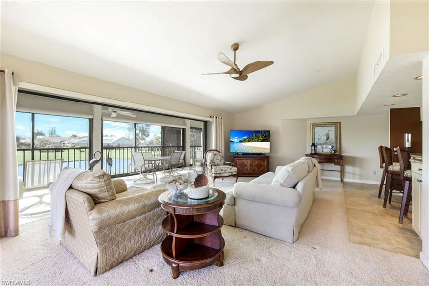 Private Elevator to Your second-floor condominium featuring an inviting Great Room plan with Western Rear Exposure and exceptional views of water, the golf course, and tropical landscapes. This fully furnished turnkey residence offers two bedrooms, two bathrooms, and a single-car garage. Dining Room Could Easily Be Converted to a 3RD Bedroom or Den. Overlooking the Bobcat Championship Golf Course #4 & #5, The condo offers raised ceilings, Window Treatments The enclosed four-season lanai is equipped with Storm Smart  electric shutters and removable vinyl windows. Easy Extra Year Round Living Space. The remodeled kitchen includes a spacious breakfast bar, stainless steel appliances, soft-close wood cabinetry with pull-outs, custom window treatments, and  blinds. Additional features comprise a well-maintained air conditioning system, Square D electrical panel, new shingle roof, extra built-in storage, and recent paint. This residence did not incur any water intrusion from Hurricane Ian. Membership to the Country Club is optional, 2026 incentive discounts are currently available for new residents. The property is conveniently located just 15 minutes from RSW Airport, within biking distance to Lakes Park's Market Day, and surrounded by over 8 miles of sidewalks, streetlights, more than 20 lakes, and abundant wildlife. Beaches such as Sanibel and Fort Myers Beach are only 20 minutes away. Some amenities described may require membership. There is also a children's park available. Discover the lifestyle offered in The Forest community. Come Live & Play In The Forest!